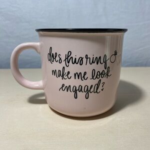 “Does this ring make me look engaged?” Mug
